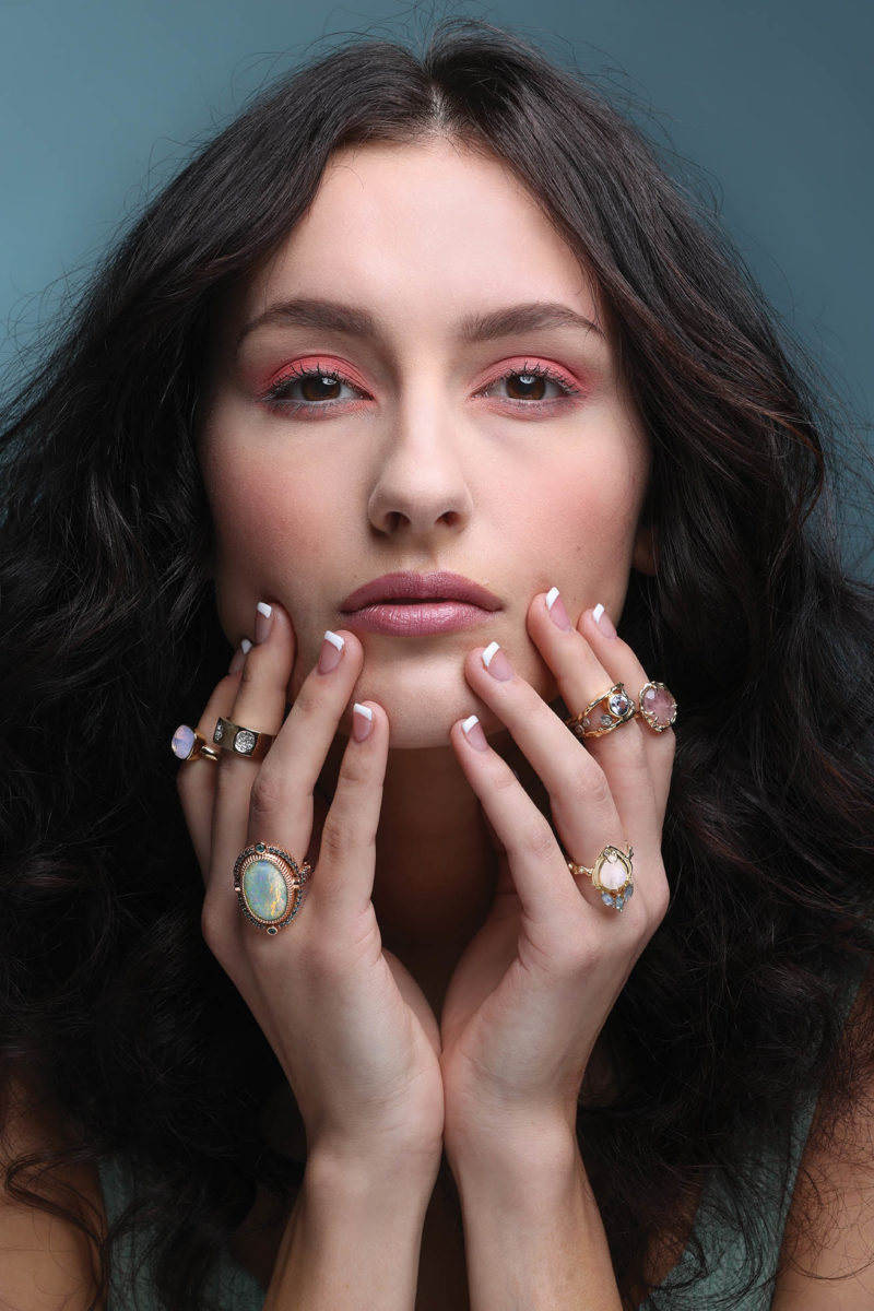 Replica rings, $298 each. Both from Coleman Collection; 20K and 18K rose gold ring set with one 12 carat black opal, untreated from Australia, $30,000. From llyn strong fine art jewelry; Celeste moonstone in 14K yellow gold, $1,260; Andromeda ring in 18K yellow gold, sterling silver, color-change sapphire, and diamonds, $5,220; Roxanna ring in 14K yellow gold with pink umba sapphire, $1,210. All from Make Made Jewelry.