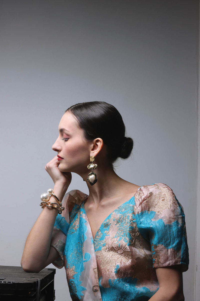 Double pearl knot bracelet, $145; replica gold-link bracelet, $425; Cristina Sabatini gold three-drop oyster-pearl inlay earrings, $225. All from Coleman Collection; Felicity petunia bodysuit, $95. From Harringtons.