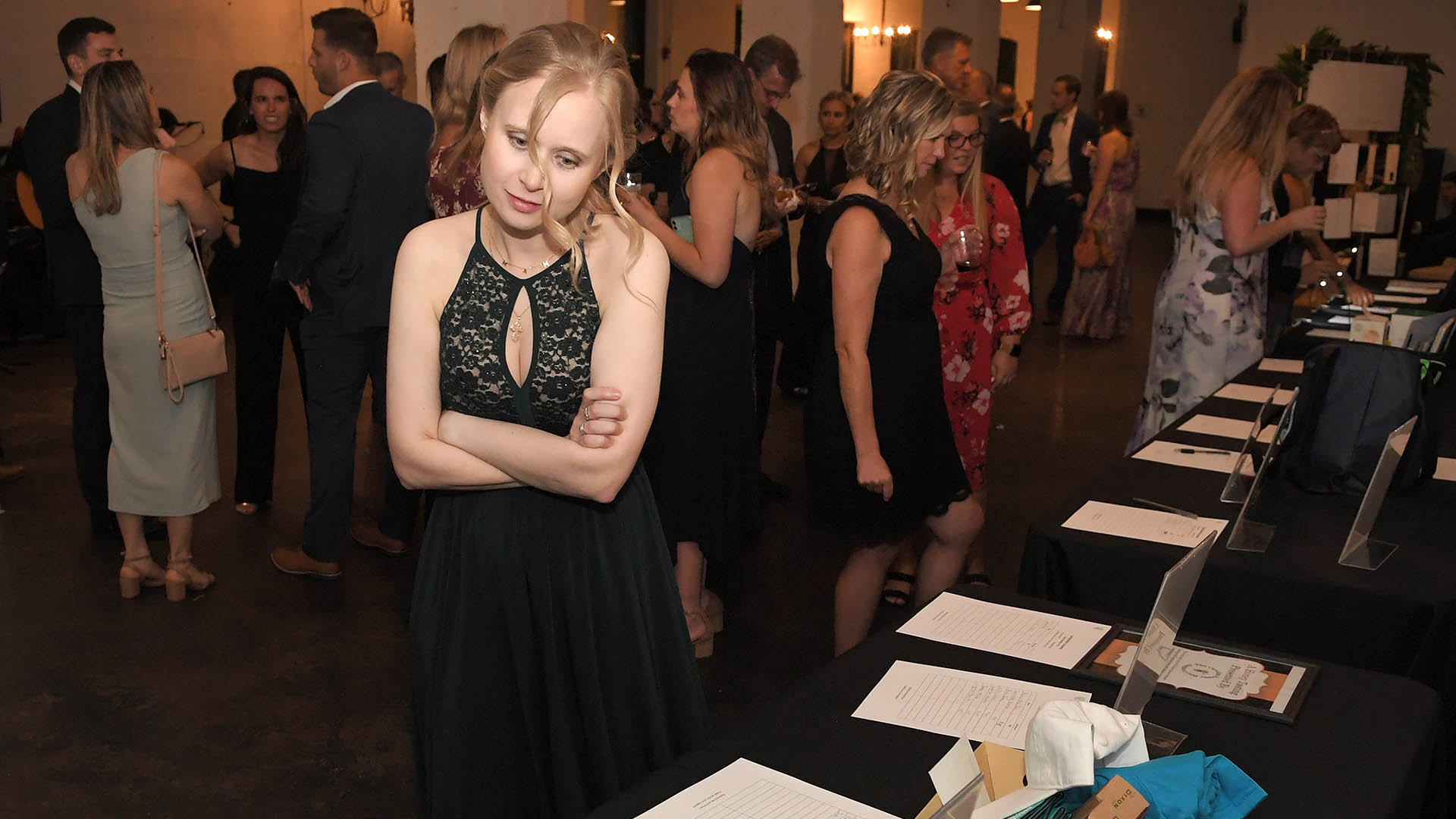 Nicole Snoad enjoys the Silent auction. AID-L hosted their Spring Gala, May 13, 2022.
