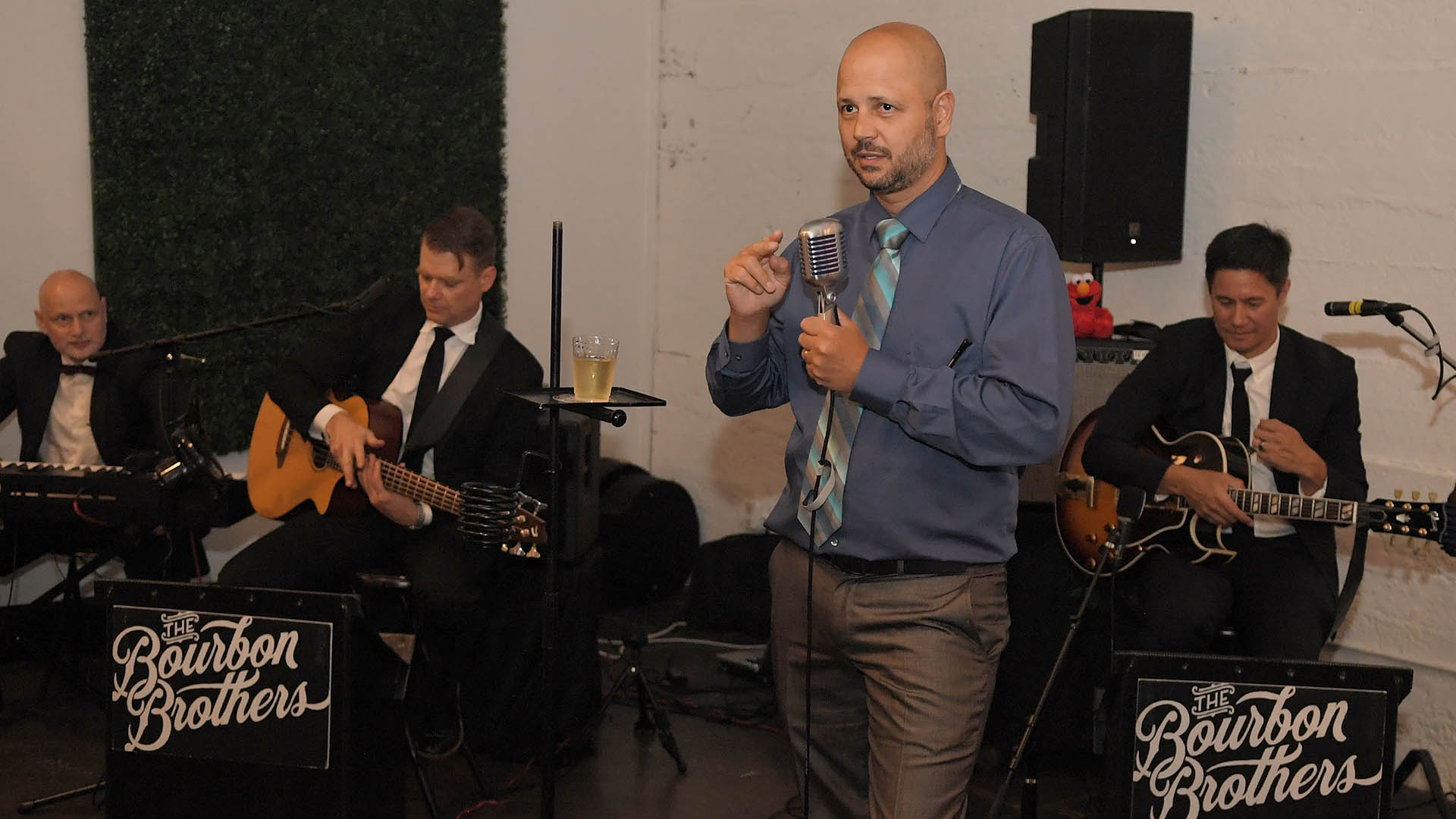 Dillon Hartley makes an announcement. AID-L hosted their Spring Gala, May 13, 2022.