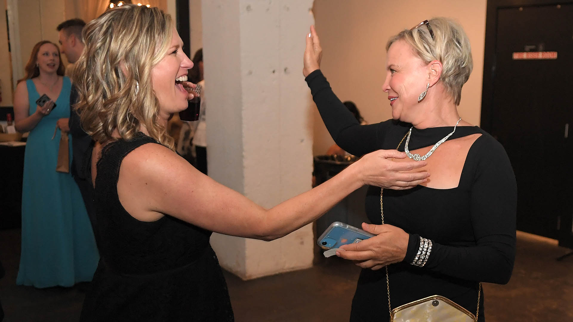 Miki Hartley and Carmen Hartley enjoy the Bourbon Brothers Band. AID-L hosted their Spring Gala, May 13, 2022.