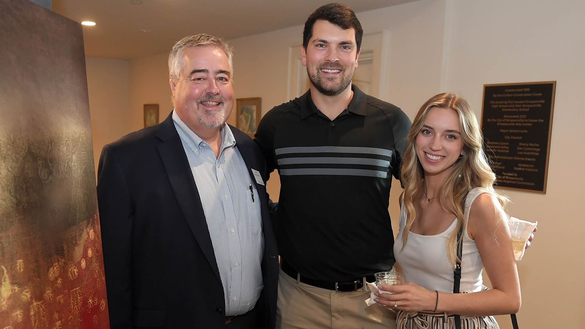 Tim Lincolnhol, Chase Brewington, and Anna Mitchum enjoy the evening. The Simpsonville Arts Center