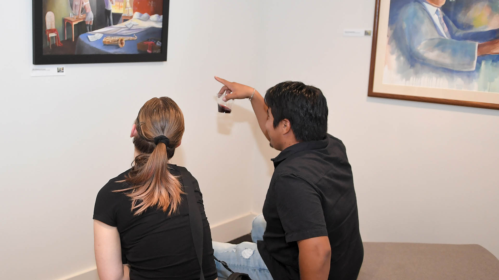 Micky Harney and Orlando Corona enjoy the evening. The Simpsonville Arts Center presented the Ed Cascone Art Exhibition