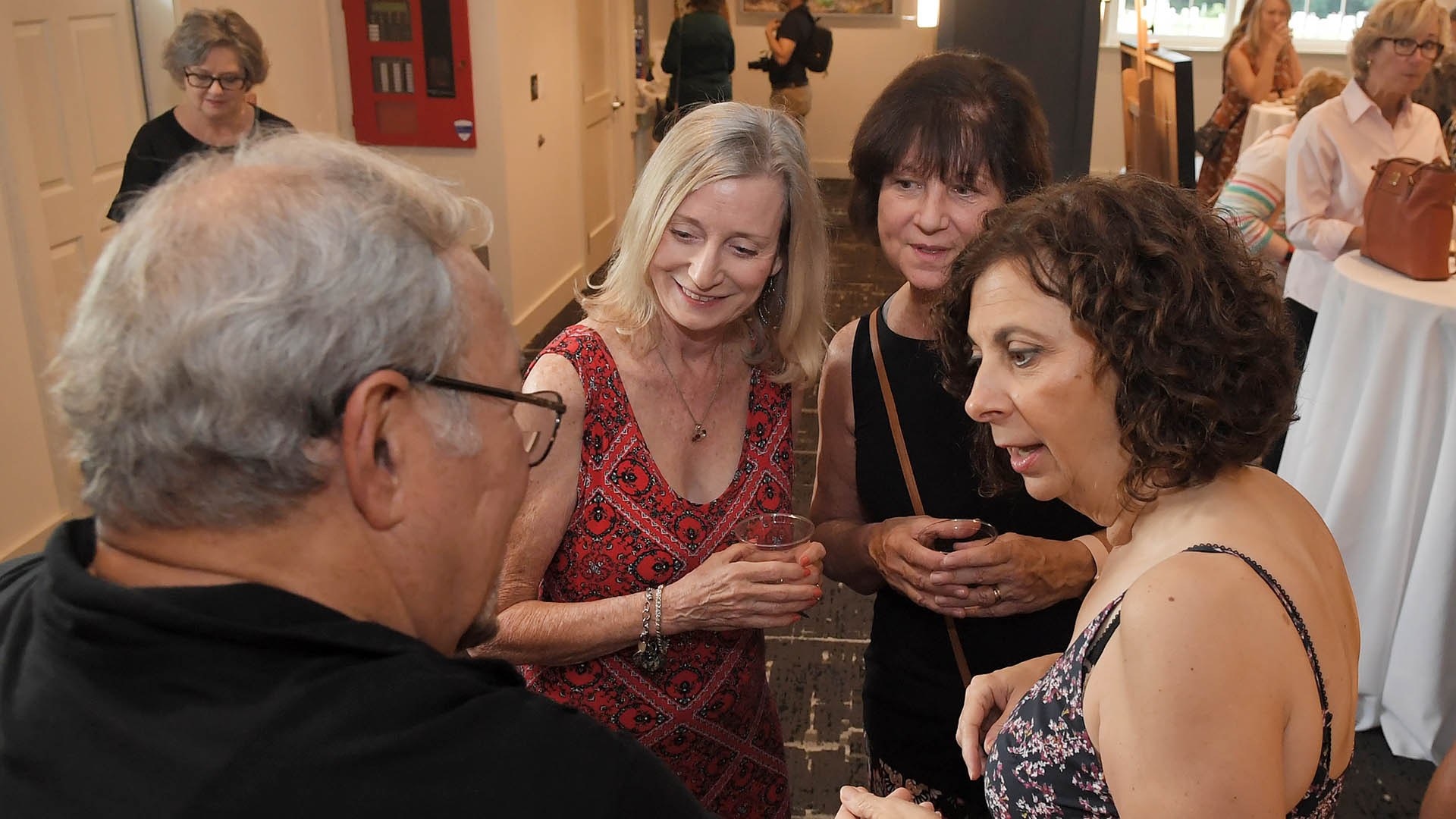 Ed Cascone enjoys conversation with Wayna Guirl, Kathy Greene and Lucille Herwald. The Simpsonville Arts Center presented the Ed Cascone Art Exhibition Tuesday, August 2, 2022.