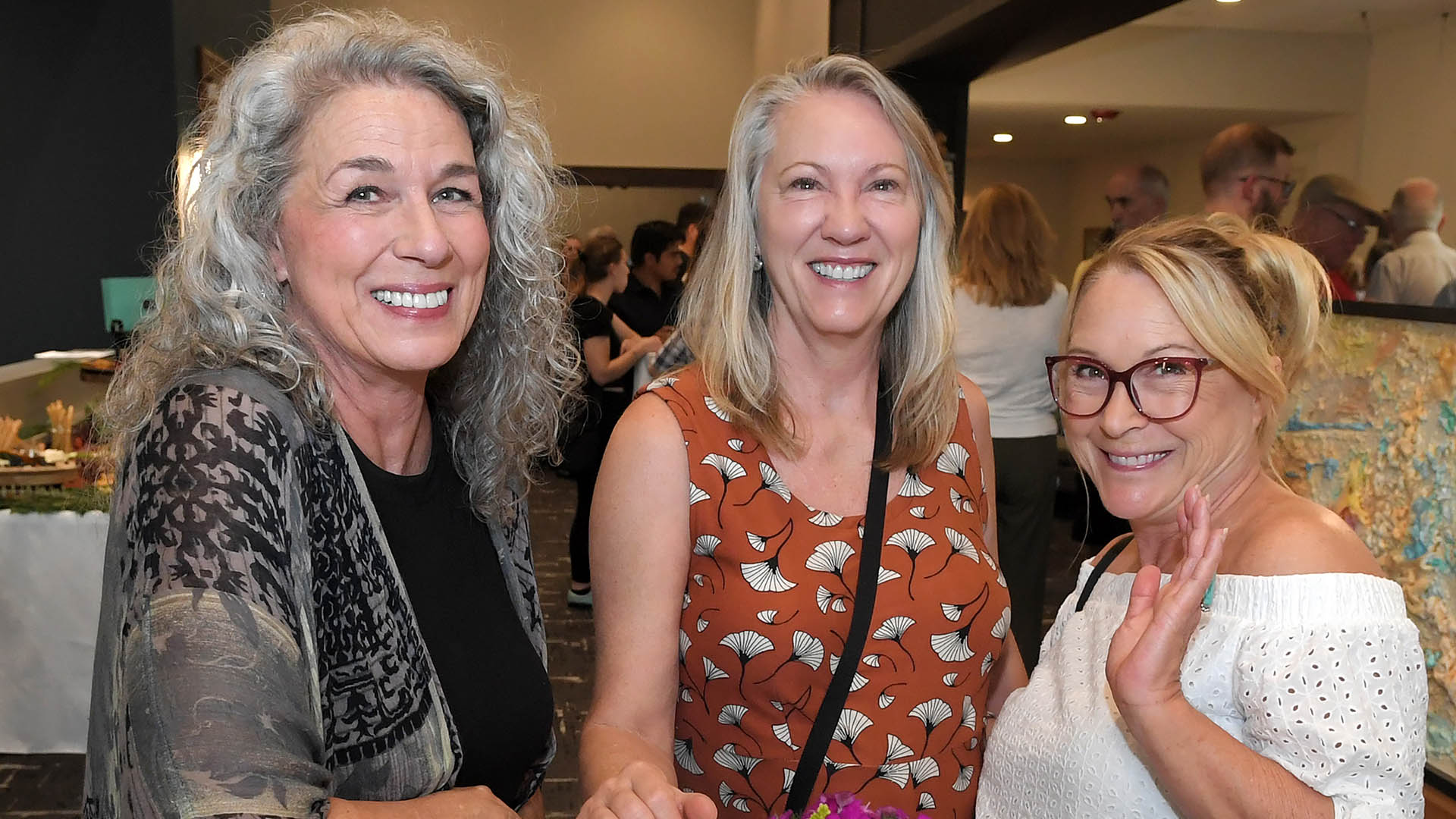 Suzette Cornish, left, Marsha Doll and Darcy Bourque enjoy the evening. The Simpsonville Arts Center presented the Ed Cascone Art Exhibition
