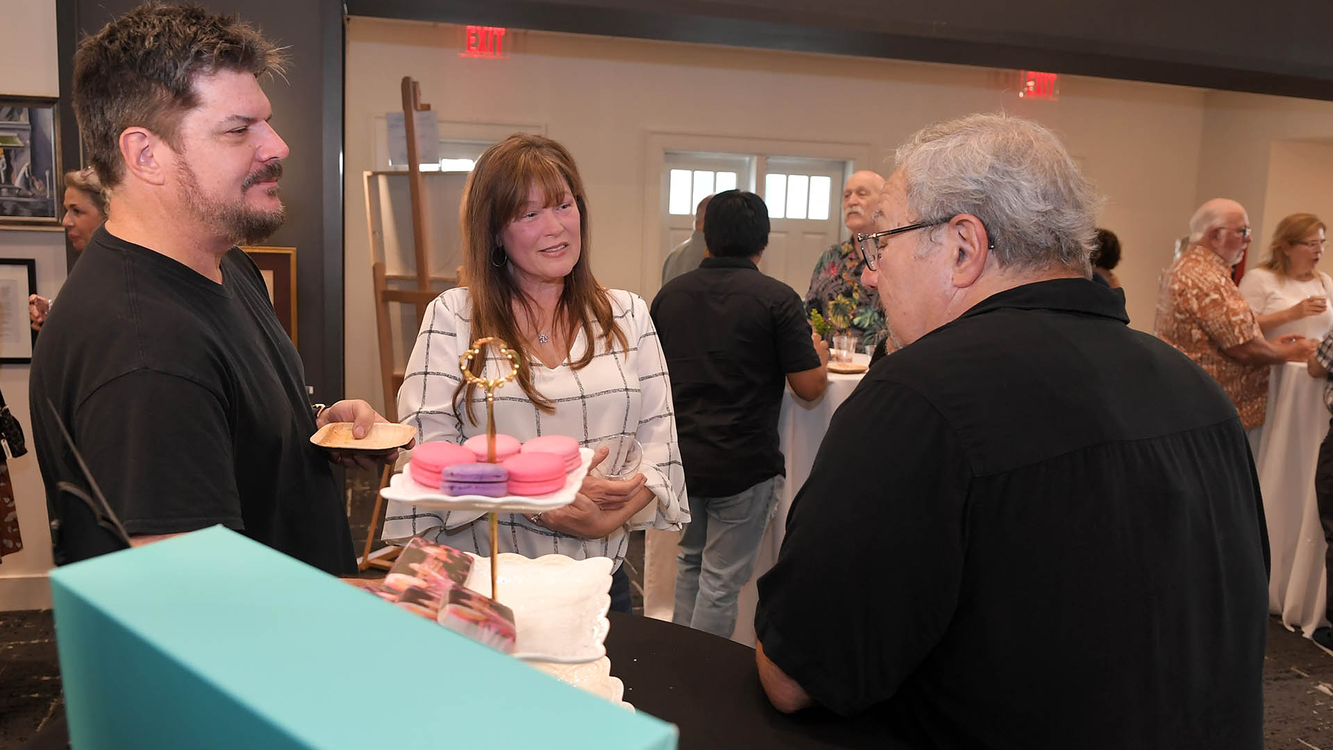 Ed Cascone, right, and Paul and Kim Komie enjoy the evening. The Simpsonville Arts Center presented the Ed Cascone Art Exhibition