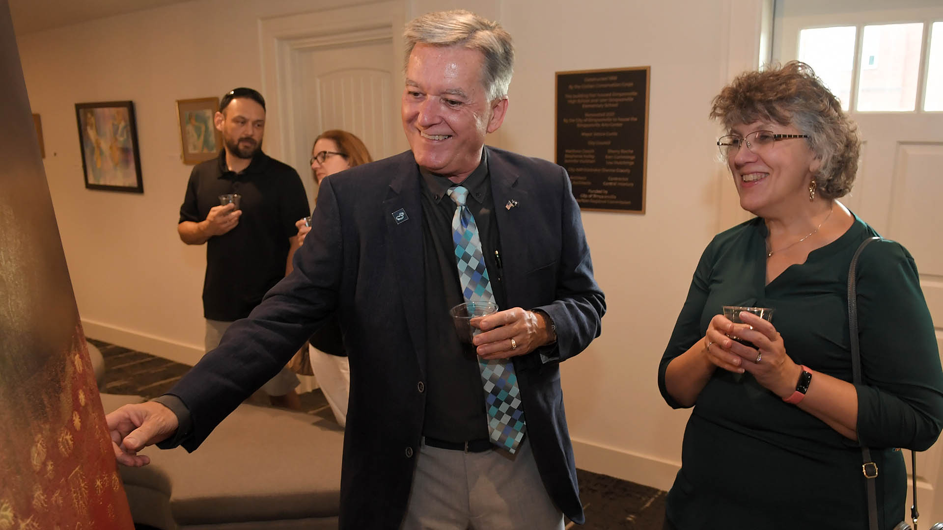 Paul and Sandy Shewmaker enjoy the evening. The Simpsonville Arts Center presented the Ed Cascone Art Exhibition
