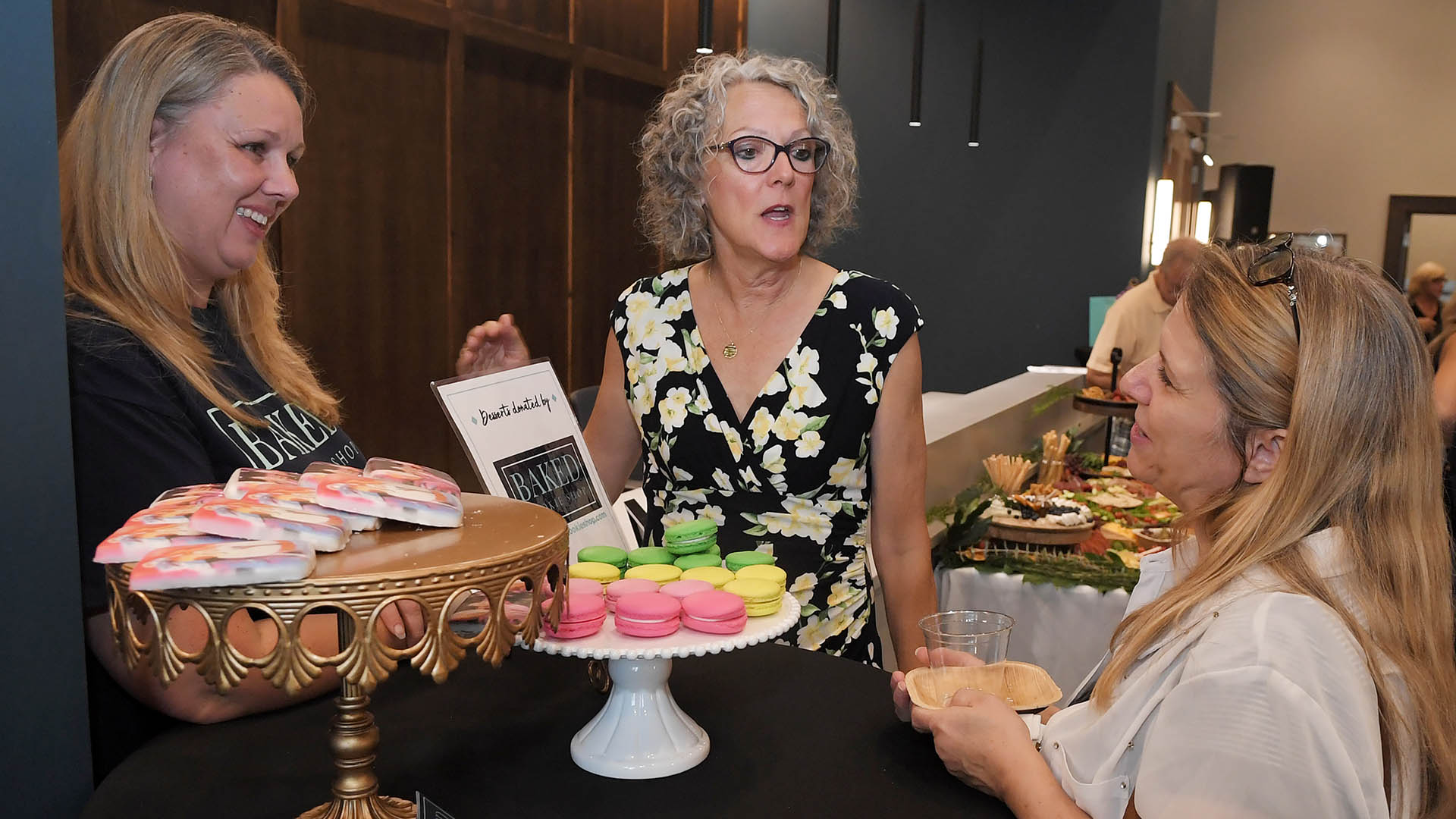Karrie Daze, with Baked Cookie Shop, left, Melissa Sturgis and Dani Sturgis enjoy the evening. The Simpsonville Arts Center presented the Ed Cascone Art Exhibition