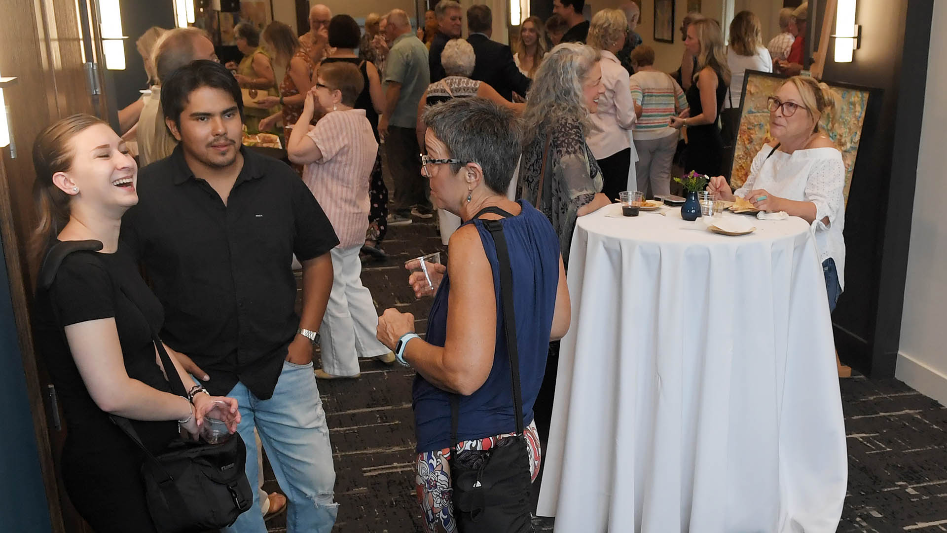 Micky Harney and Orlando Corona enjoy the evening. The Simpsonville Arts Center presented the Ed Cascone Art Exhibition