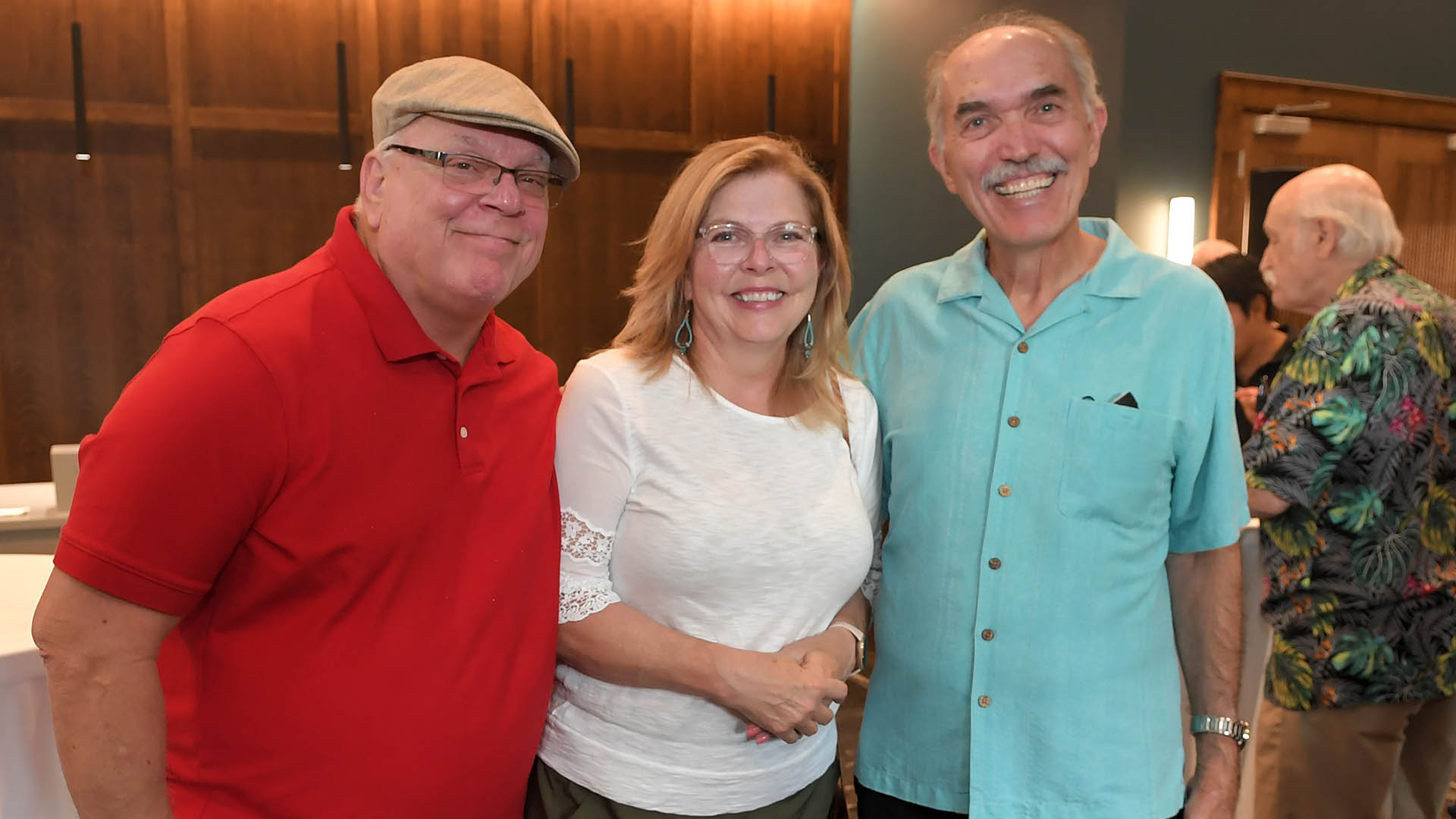 Steve and Susan Skipwith, left, and George Isidoridy enjoy the evening. The Simpsonville Arts Center presented the Ed Cascone Art Exhibition
