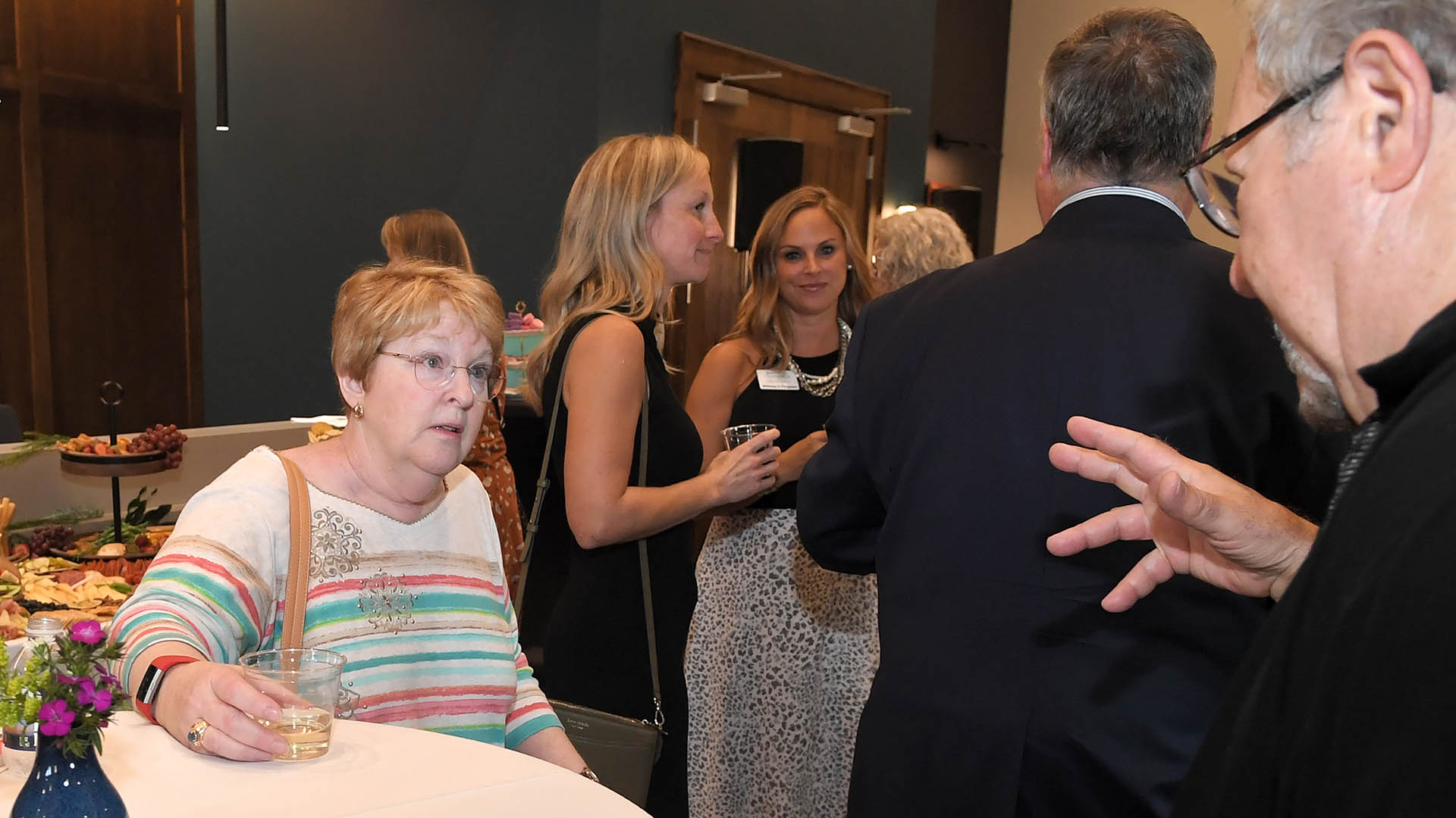 Betsy McCarthy enjoys conversation with Ed Cascone. The Simpsonville Arts Center presented the Ed Cascone Art Exhibition