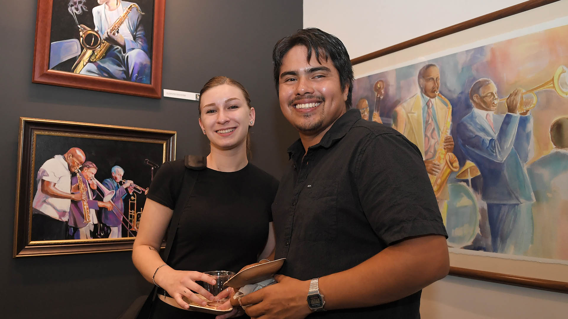 Micky Harney and Orlando Corona enjoy the evening. The Simpsonville Arts Center presented the Ed Cascone Art Exhibition
