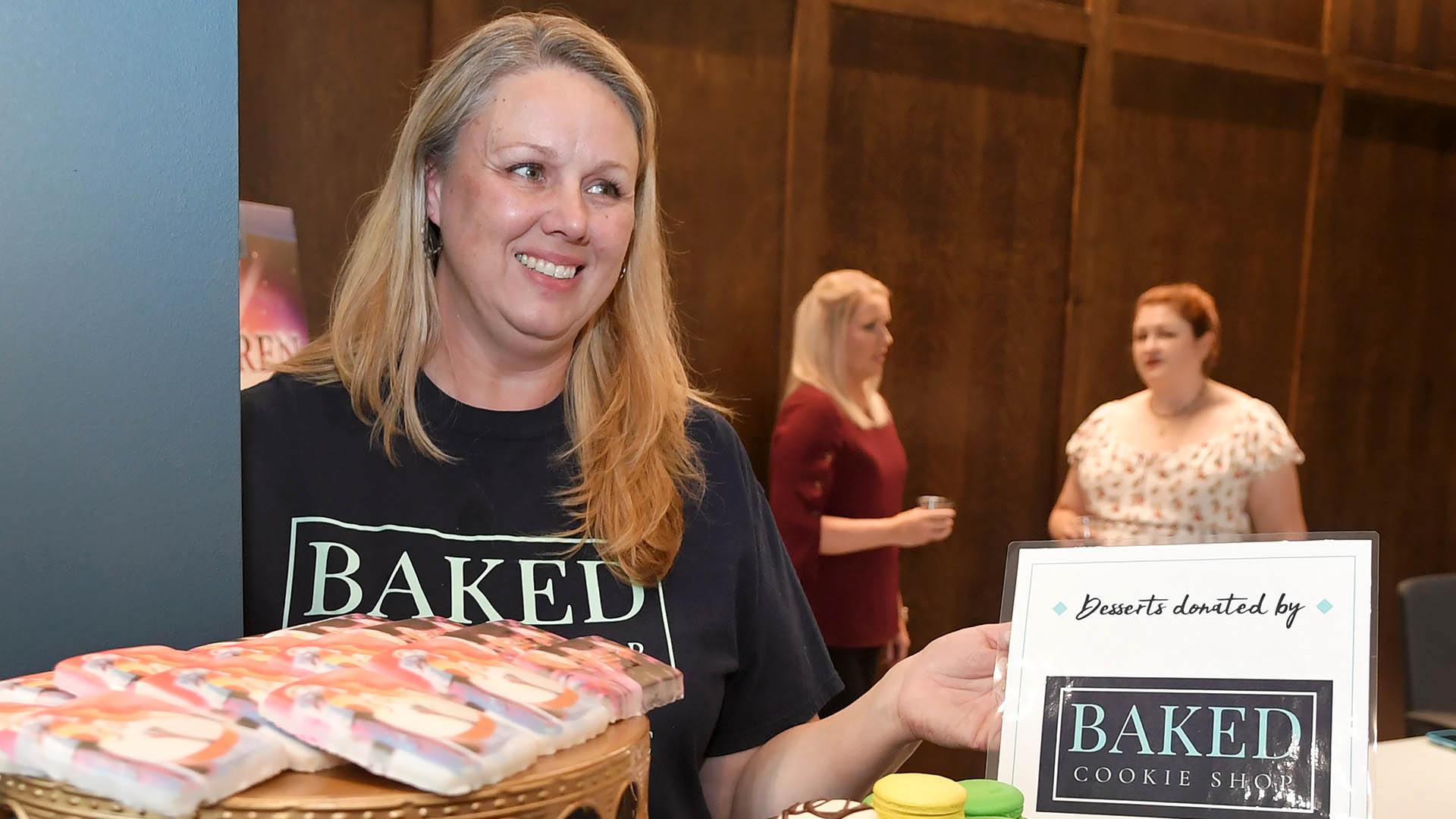 Karrie Daze, from Baked Cookie Shop, offers her specialties. The Simpsonville Arts Center presented the Ed Cascone Art Exhibition