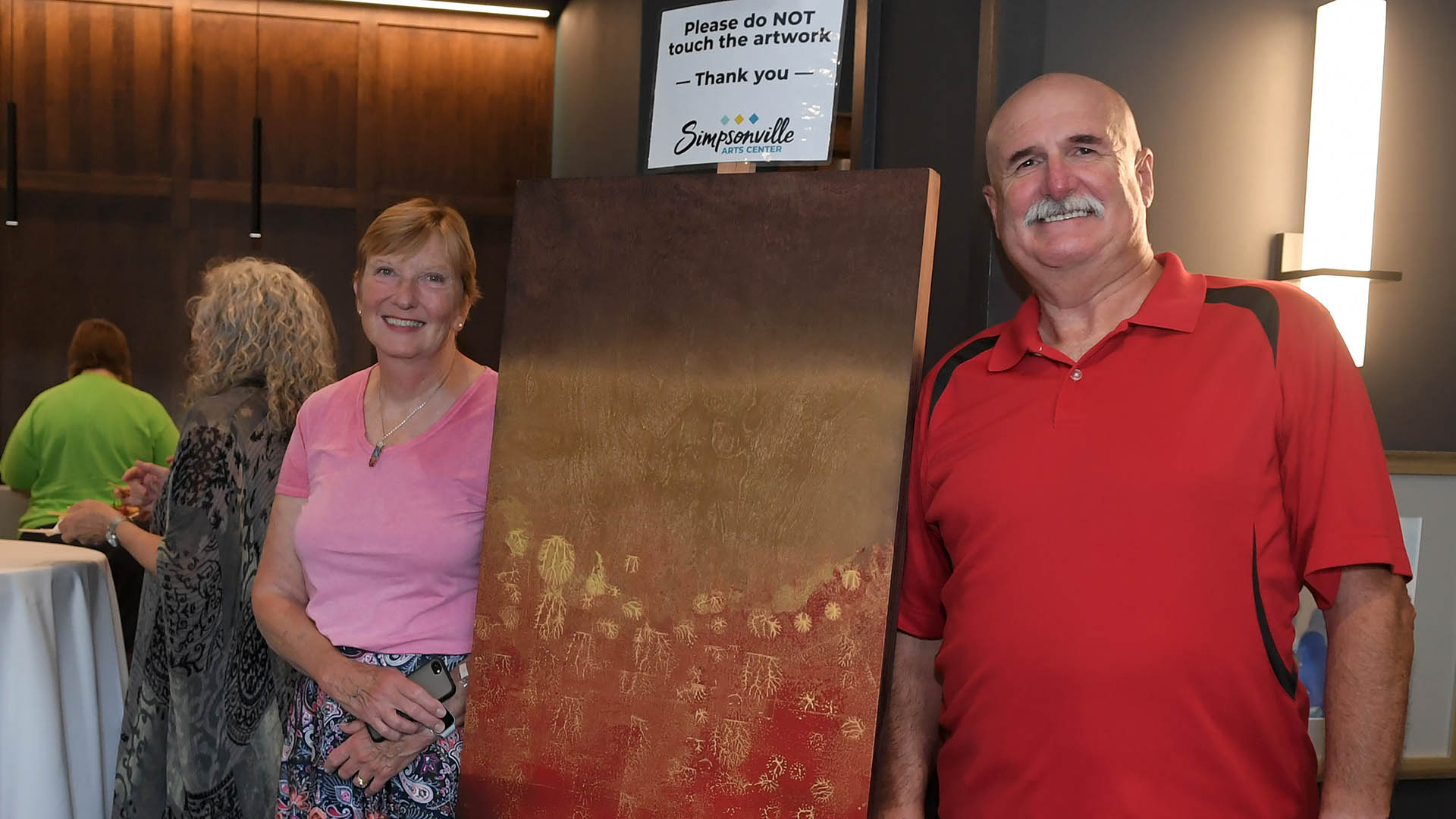 Jan and Ed Reed welcome guests. The Simpsonville Arts Center presented the Ed Cascone Art Exhibition