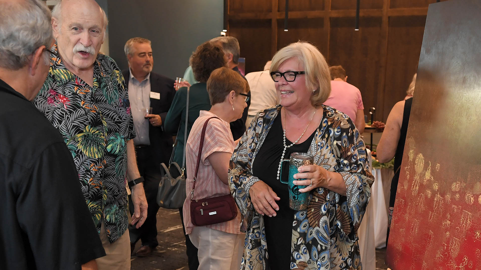 Craig Manning, center enjoys conversation with Ed and Charlene Cascone. The Simpsonville Arts Center presented the Ed Cascone Art Exhibition