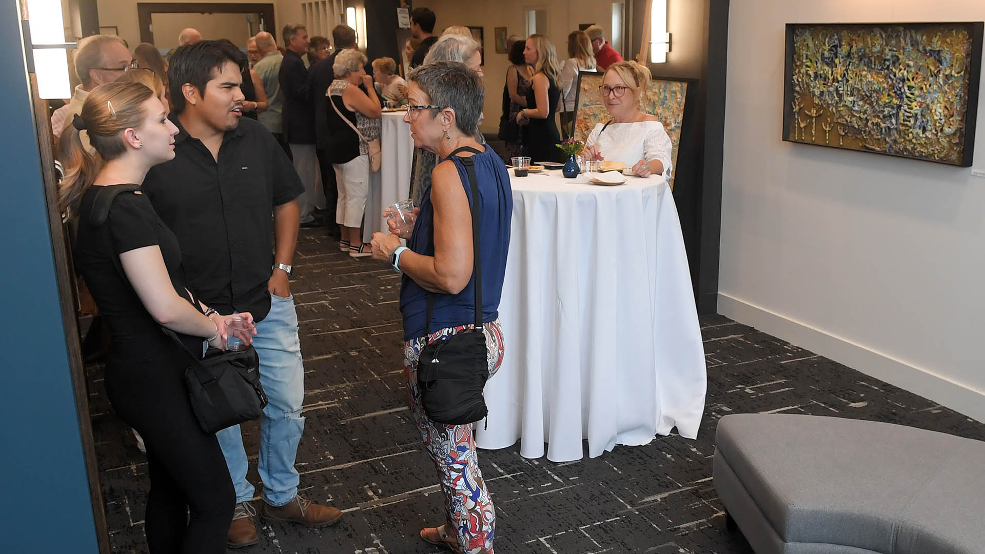 Micky Harney and Orlando Corona enjoy the evening. The Simpsonville Arts Center presented the Ed Cascone Art Exhibition