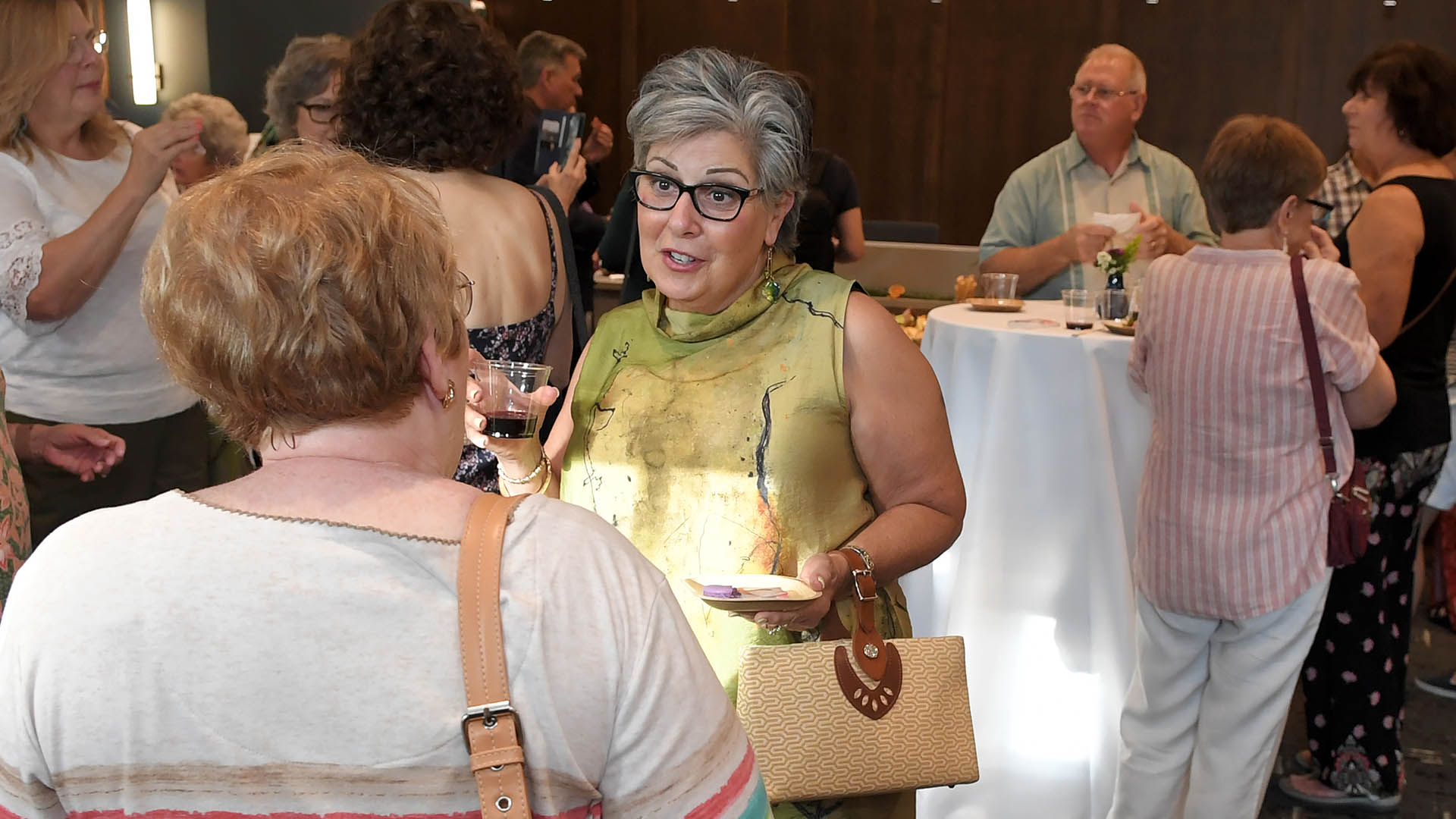Lisa Briganti enjoys the evening with friends. The Simpsonville Arts Center presented the Ed Cascone Art Exhibition