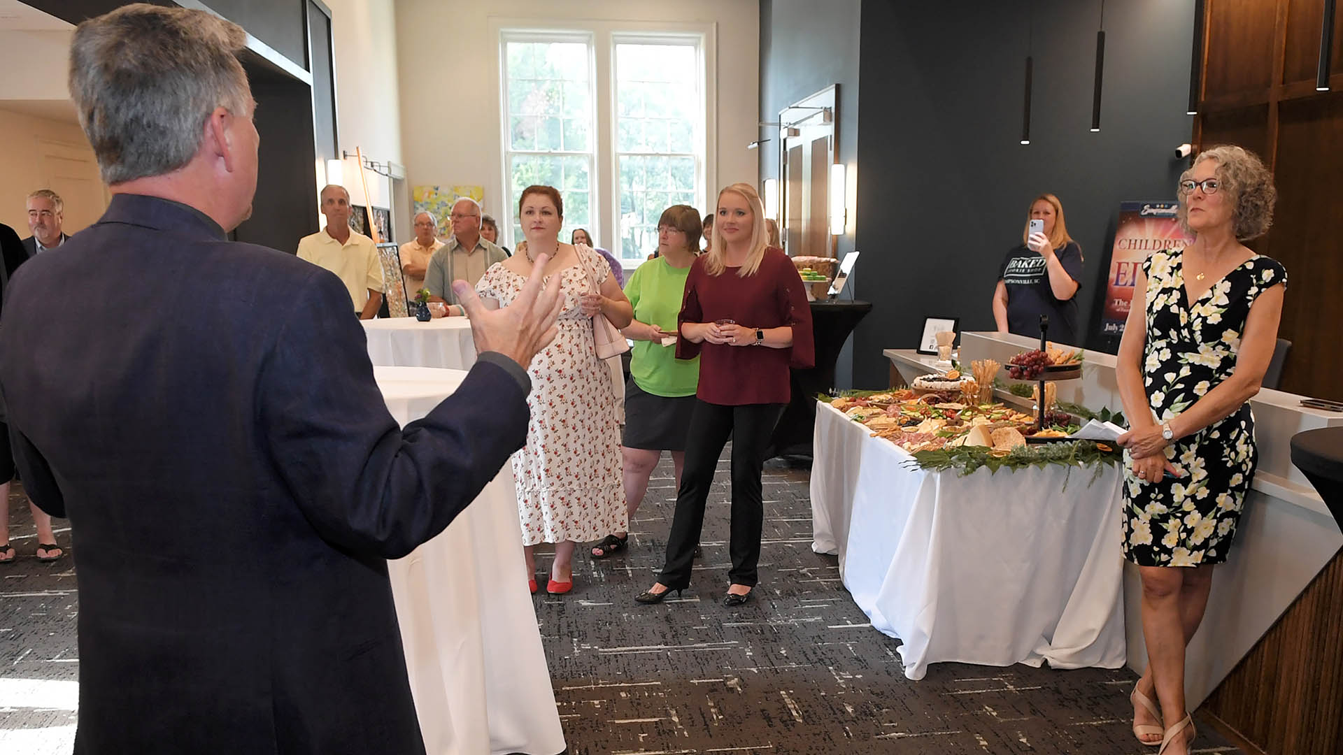 Simpsonville Mayor Paul Shewmaker welcomes the guests. The Simpsonville Arts Center presented the Ed Cascone Art Exhibition