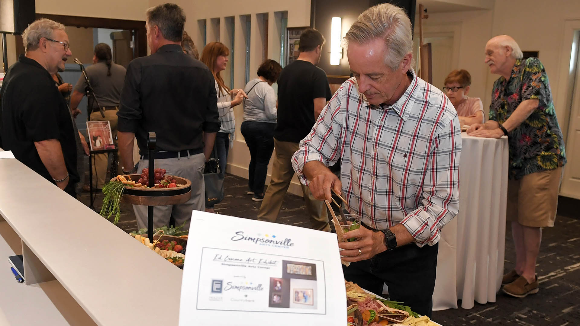 Doug Sturgis enjoys the evening. The Simpsonville Arts Center presented the Ed Cascone Art Exhibition