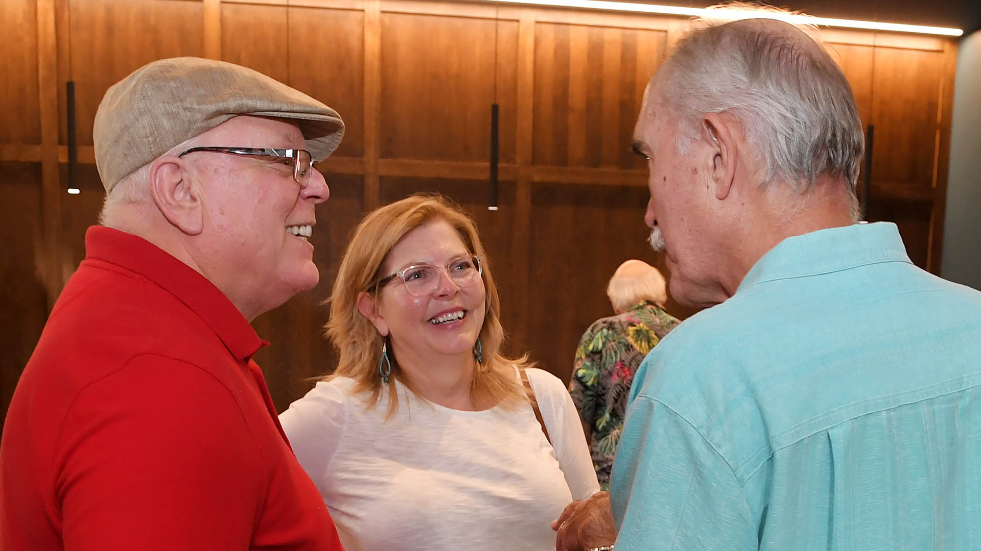 Steve and Susan Skipwith, left, and George Isidoridy enjoy the evening. The Simpsonville Arts Center presented the Ed Cascone Art Exhibition