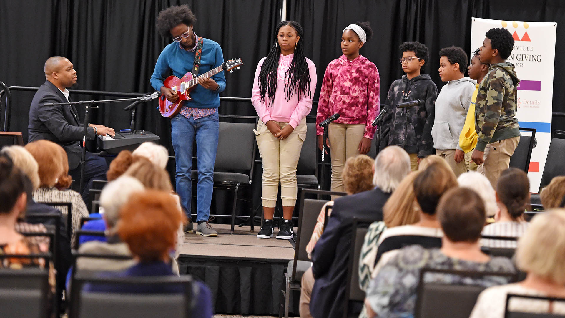 Brandon Coleman and members of the Phillis Wheatley Repertory Theatre entertain guests.